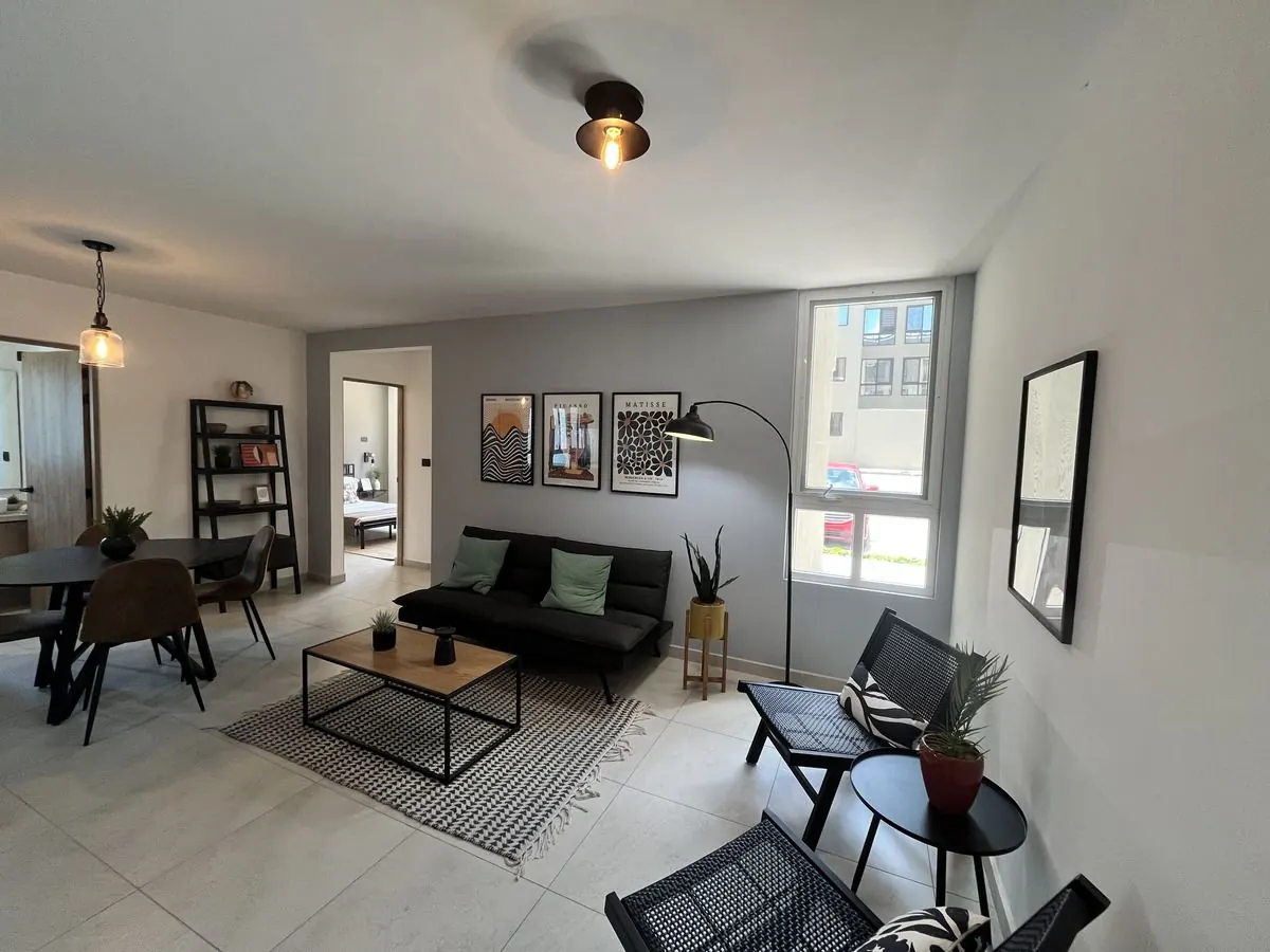 Sala y comedor del departamento Nogal 1 de 74 m² en El Refugio, Querétaro